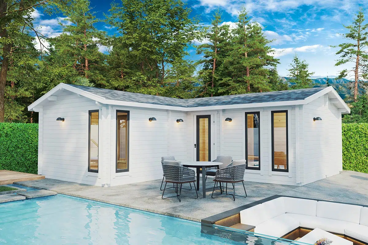 Two bedroom corner log cabin in the garden. Painted white.