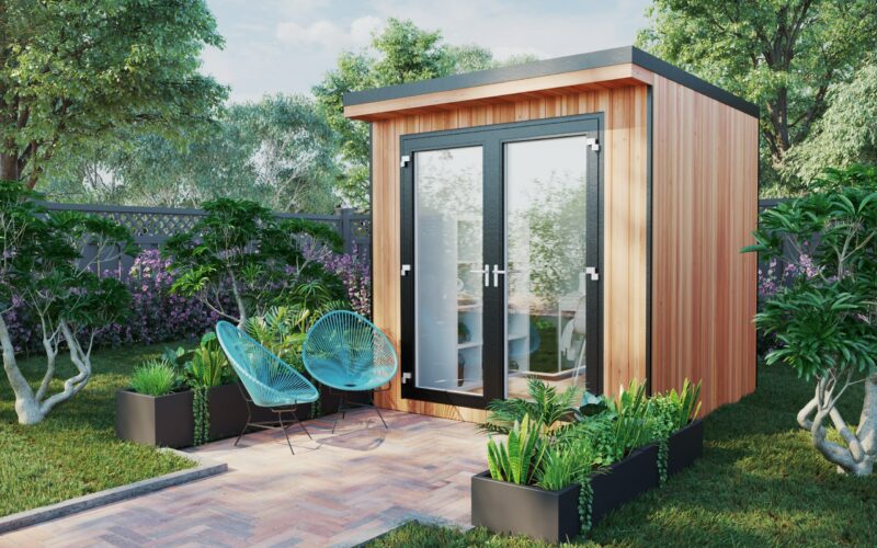 small garden office with outdoor chairs