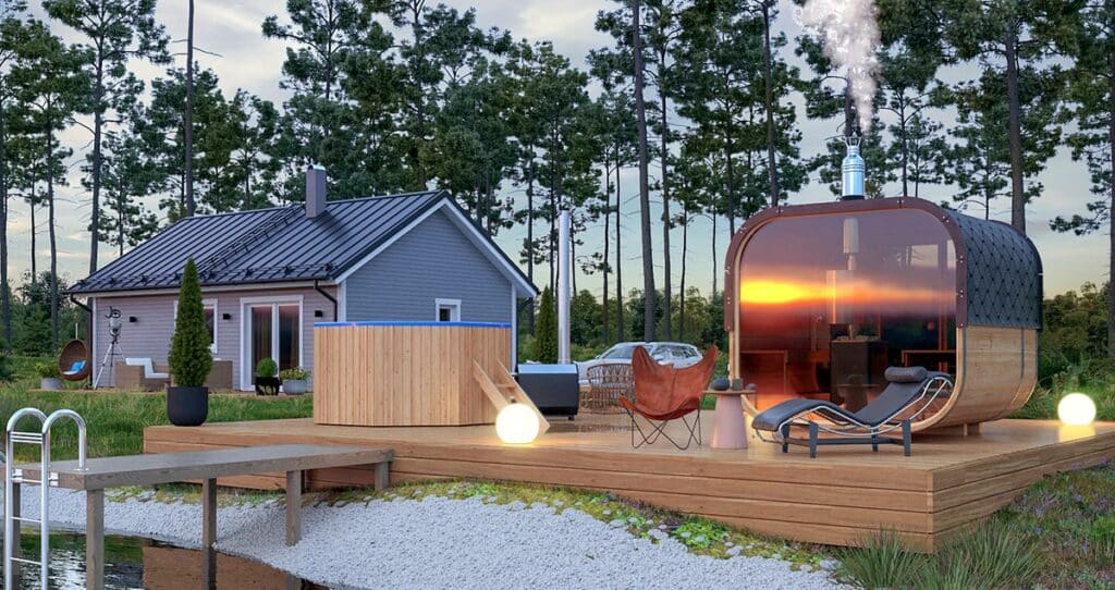 barrel sauna in the garden with a summer house