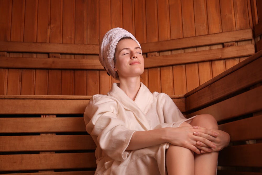 lady comfortably taking sauna