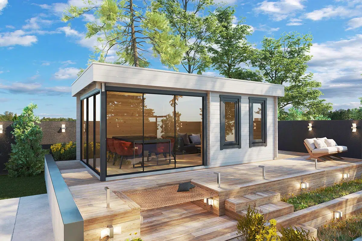 Contemporary garden room with aluminium sliding doors painted white and black