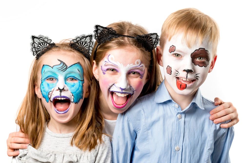 3 kids painted face as animals