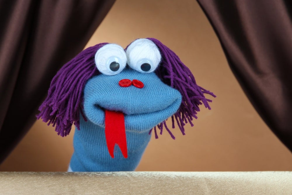 blue sock puppet with red tongue