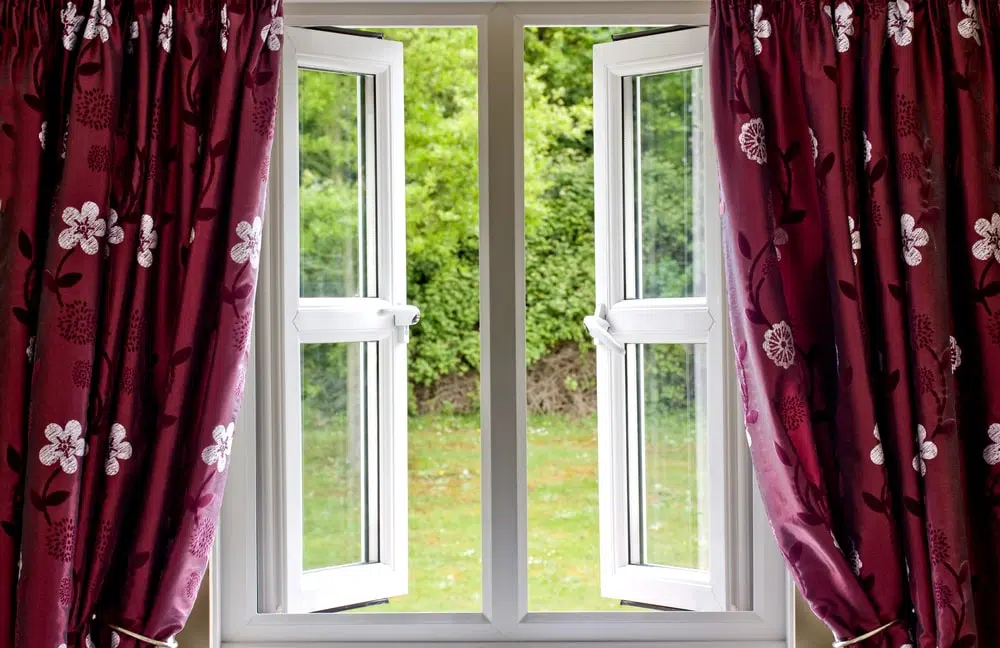 double glazed window with red curtain