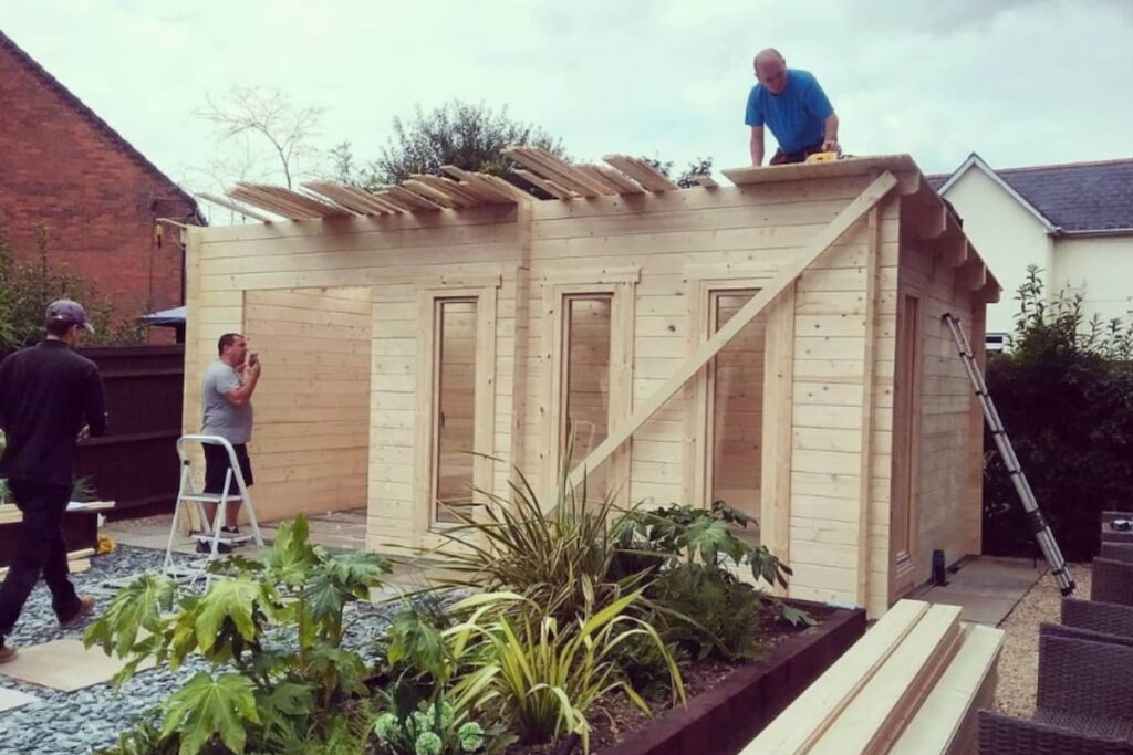 summer house being installed by workers