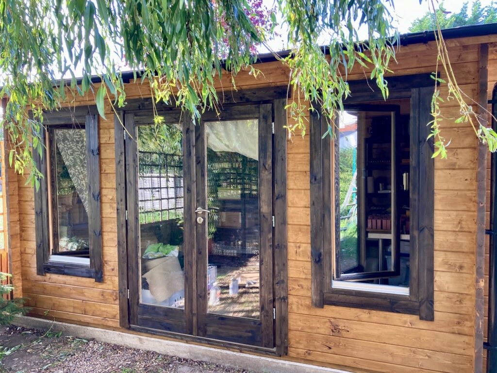 wooden garden room in a garden