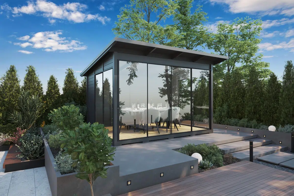 Modern grey garden room with glass wall