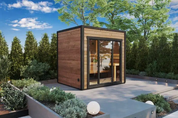 Small modern cube shaped garden sauna made from thermowood
